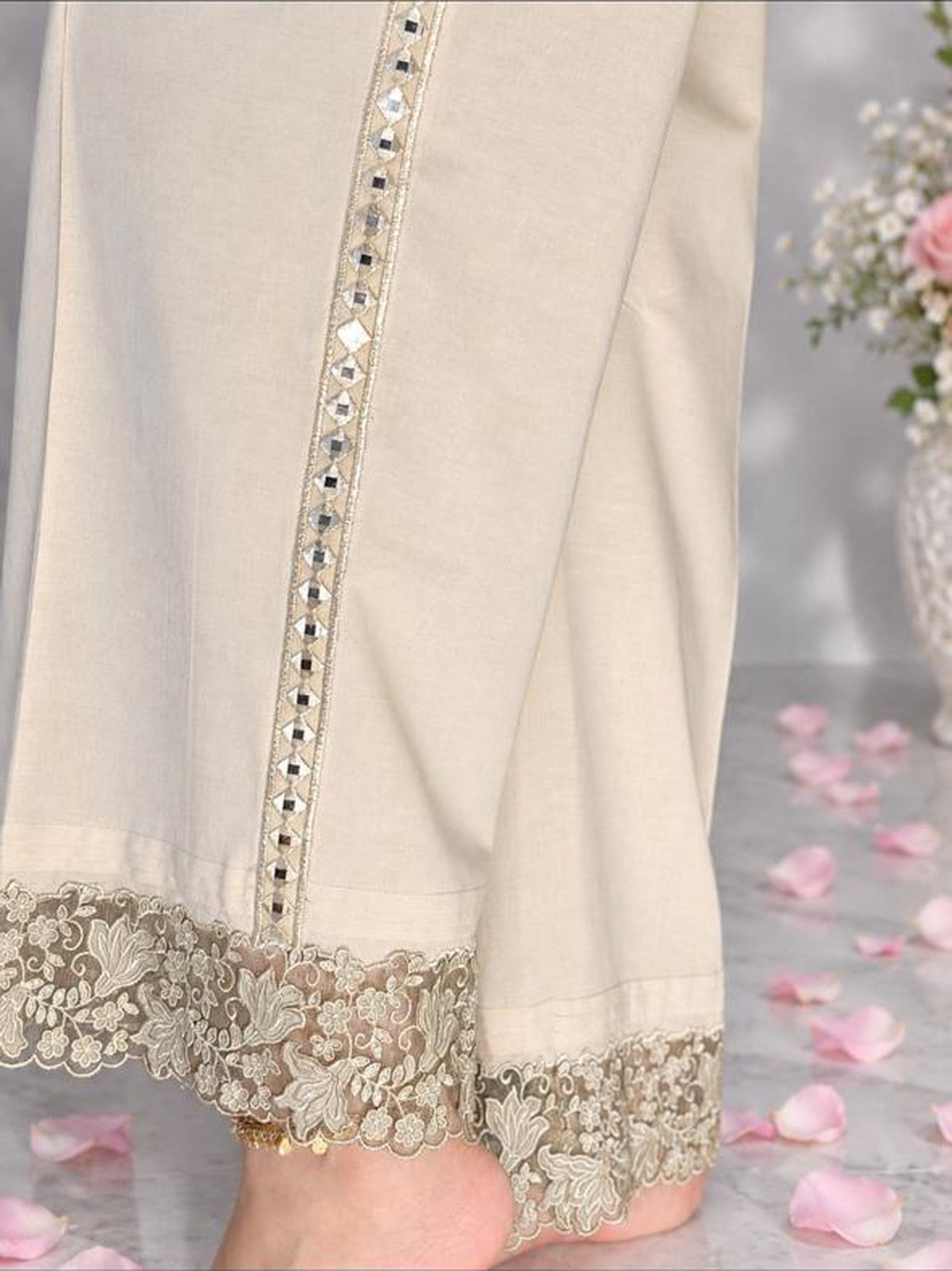Hazel Lawn Trouser - close detail of mirror-work side seam and floral lace hem